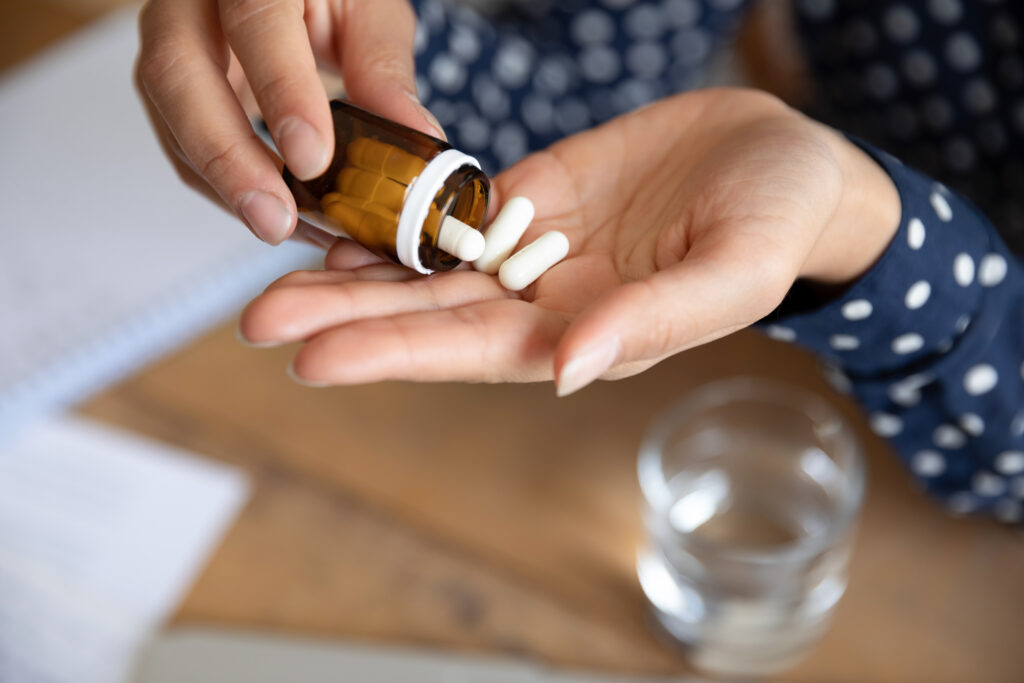 Woman taking a pill