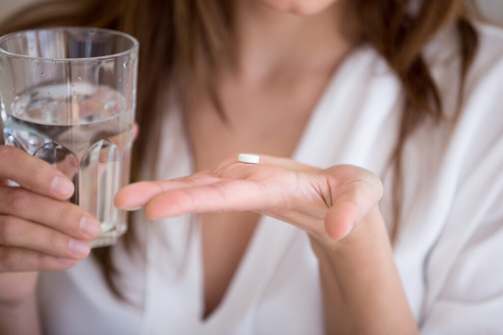 Woman taking a pill