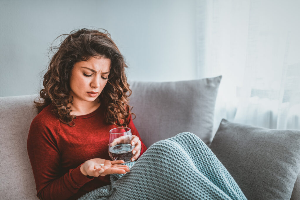 Woman taking a pill