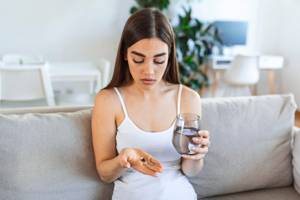 Woman Taking Pill