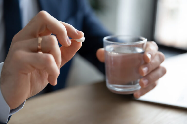 Person taking a pill