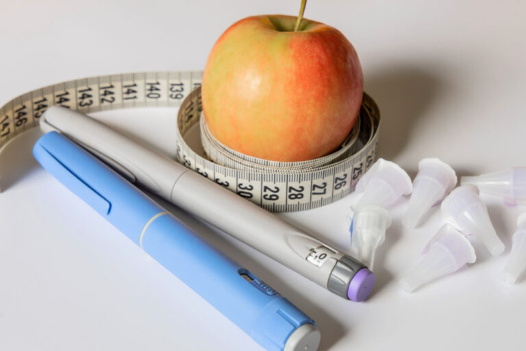 Image of weight loss pen, cloth tape measure and apple to show where can I find Wegovy in stock?